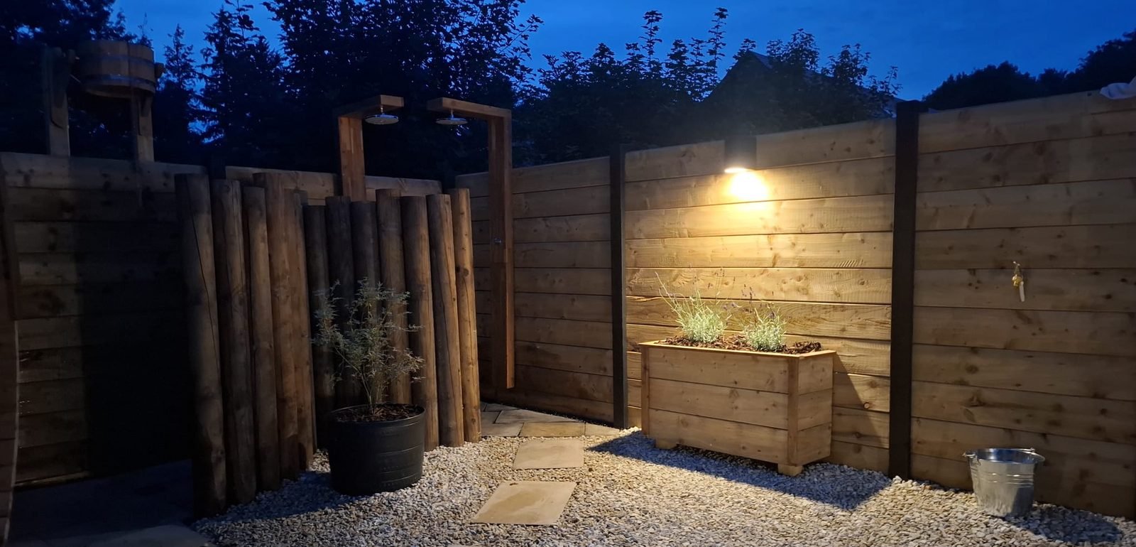 Courtyard pathway at dusk at B & M Saunas