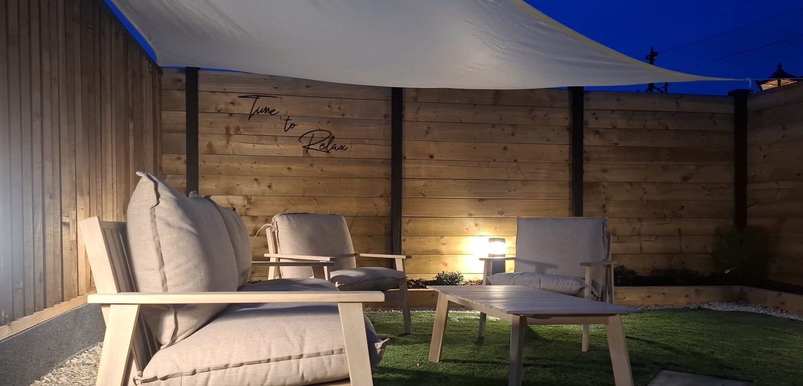 Lounge seating area at dusk at B & M Saunas