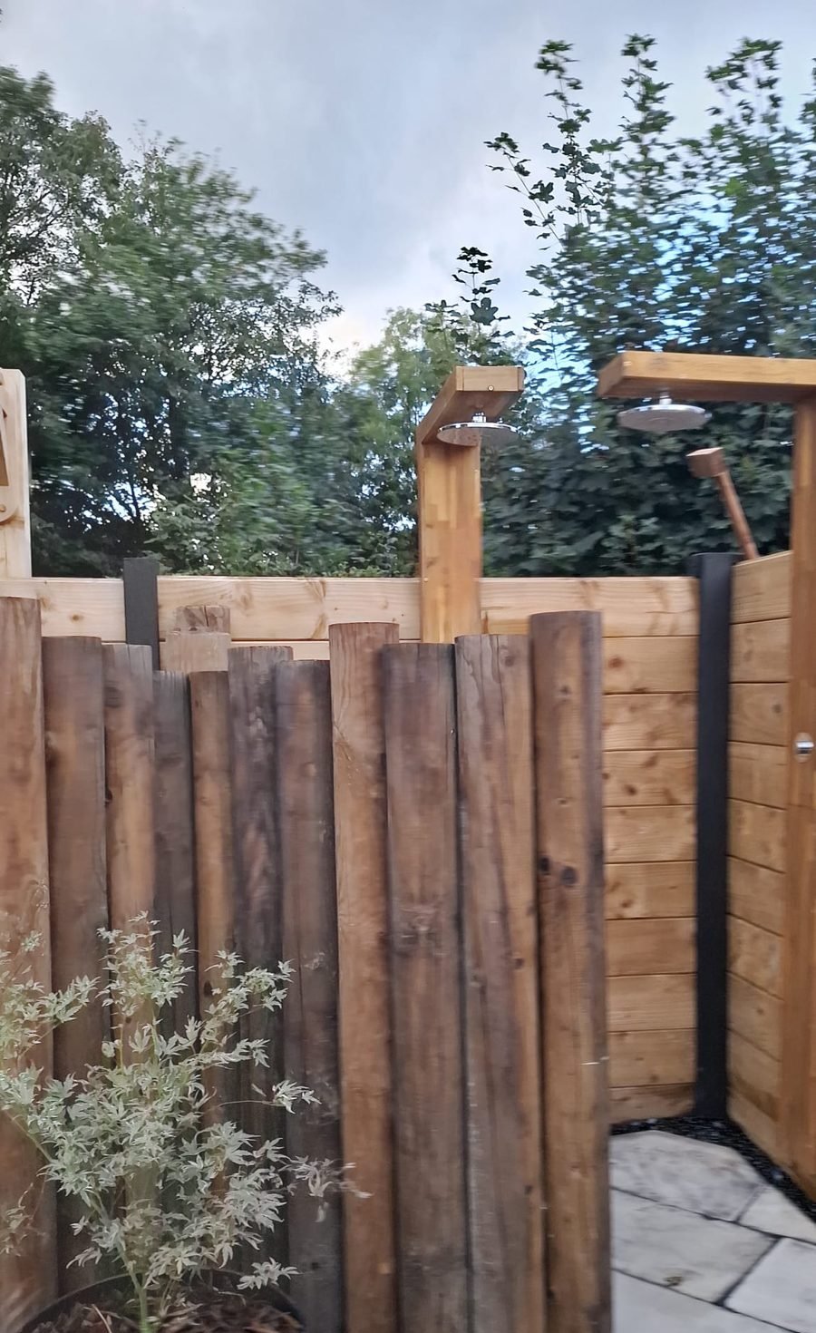 Outdoor shower area at B & M Saunas